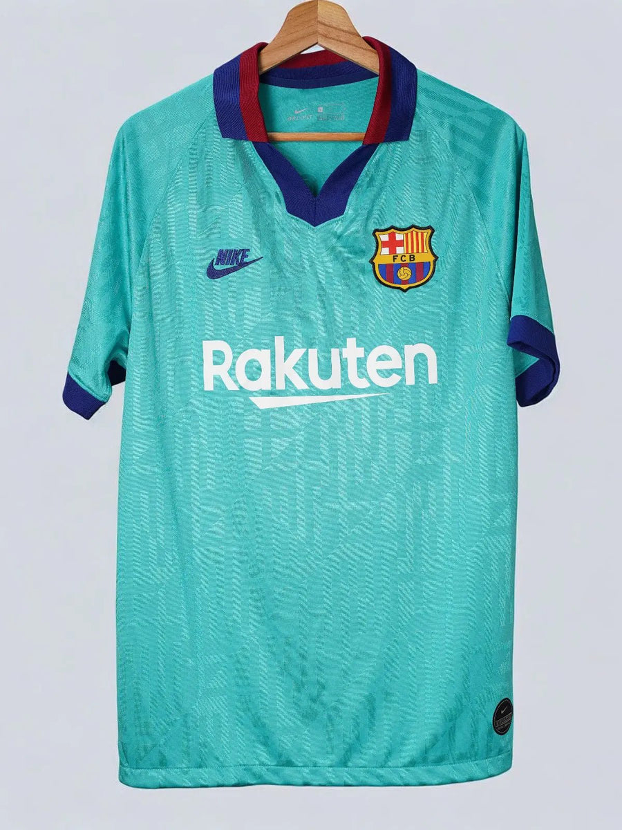 Green sports jersey with Nike and Rakuten logos on a white background
