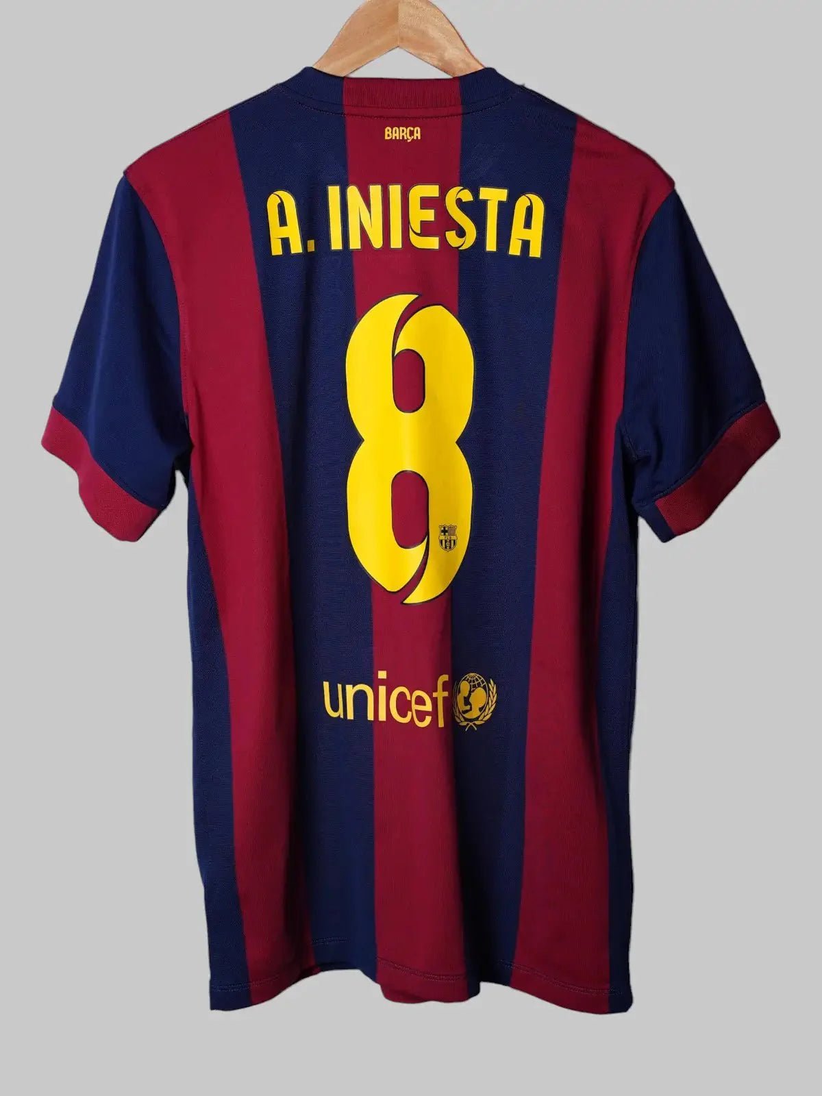 Andrés Iniesta football shirt from FC Barcelona and the Spain national team.