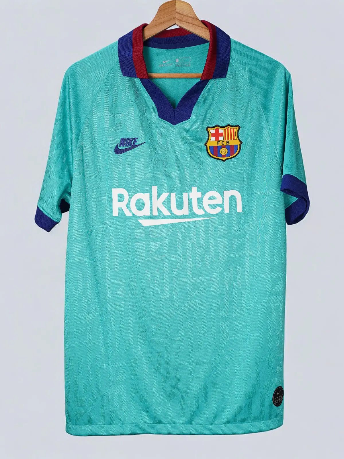 Green sports jersey with Nike and Rakuten logos on a white background